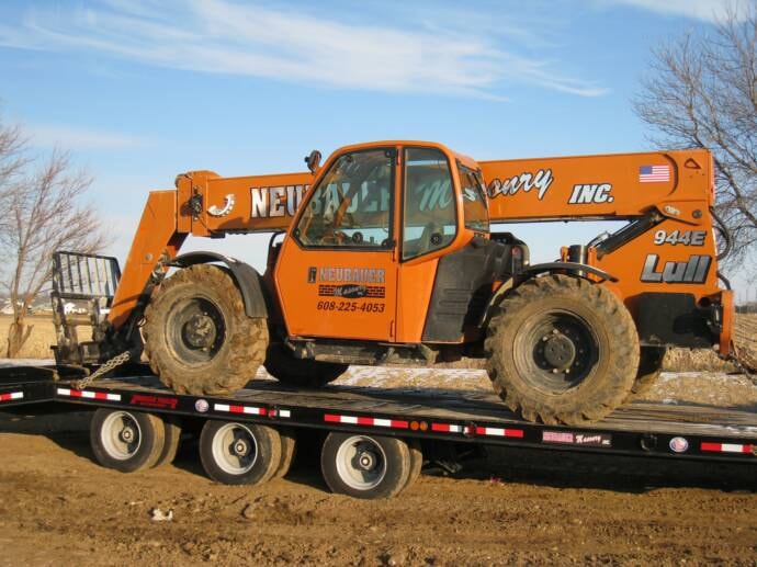 Neubauer Masonry Lull 944E telehandler on flatbed trailer